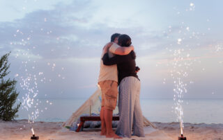 Couple sharing a quiet moment after their beach proposal