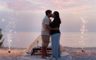 Couple embracing during their Cozumel beach proposal