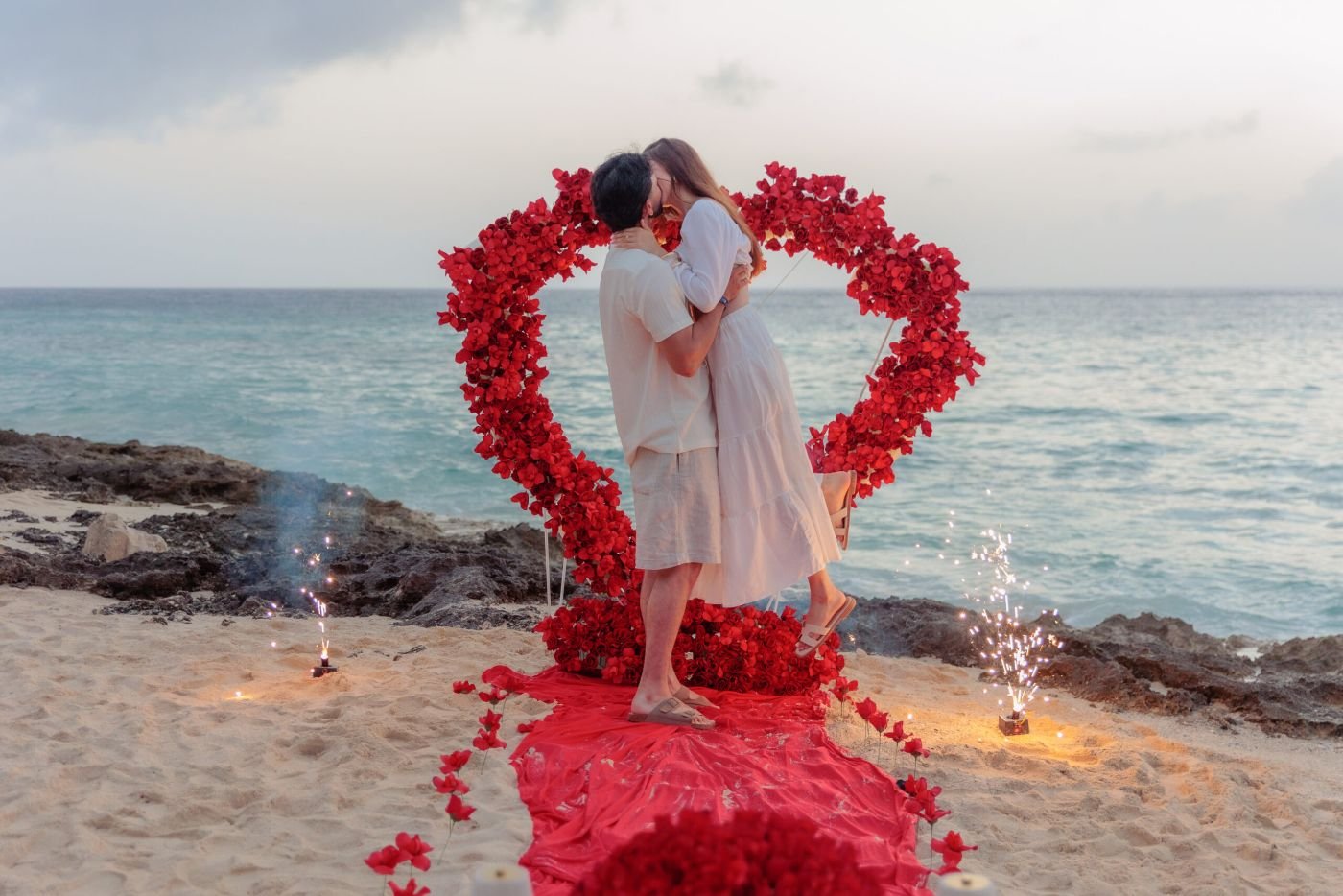Rose petal heart arch proposal setup facing the ocean in Cozumel