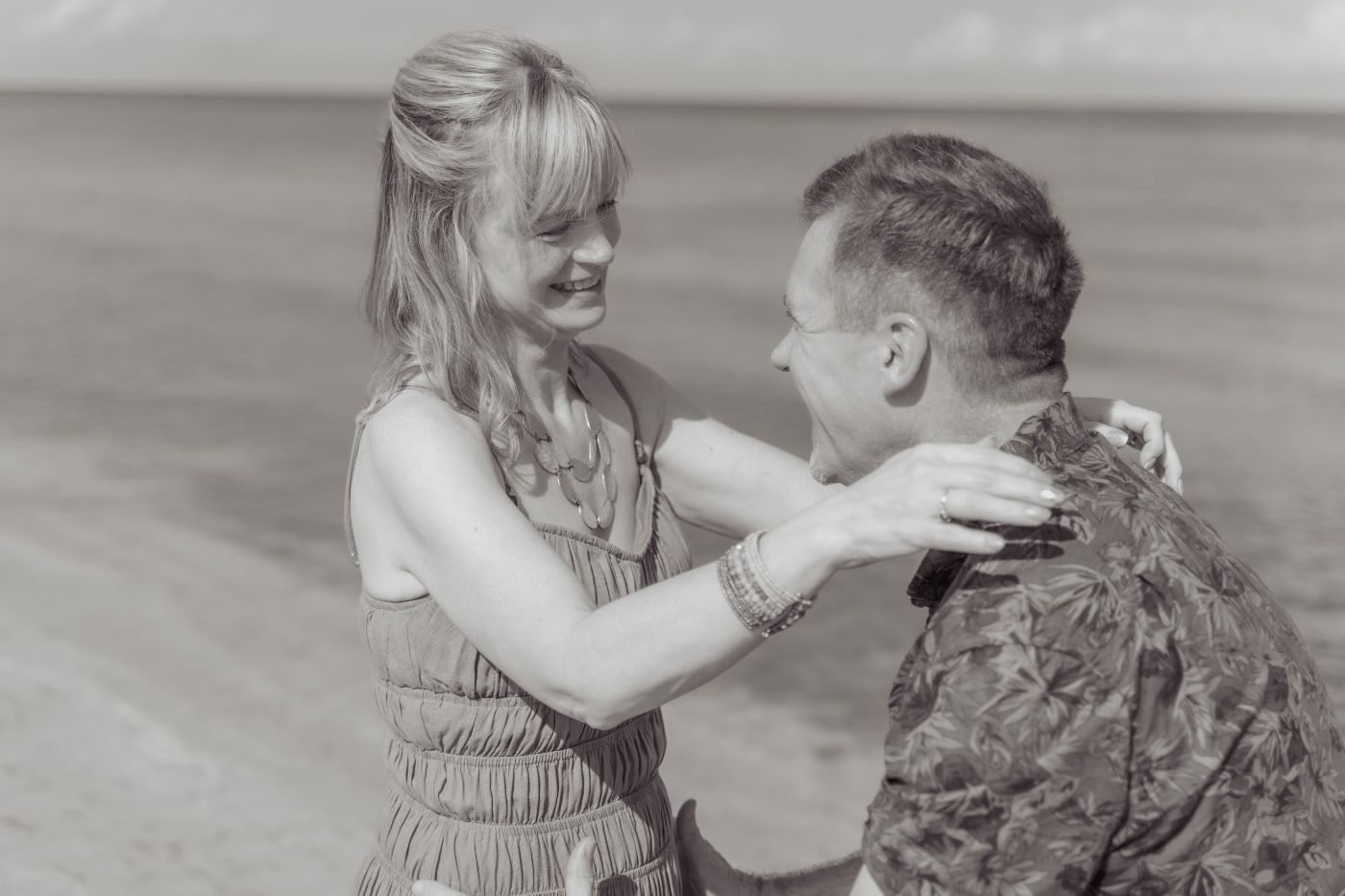 Couple laughing at the shoreline in Cozumel
