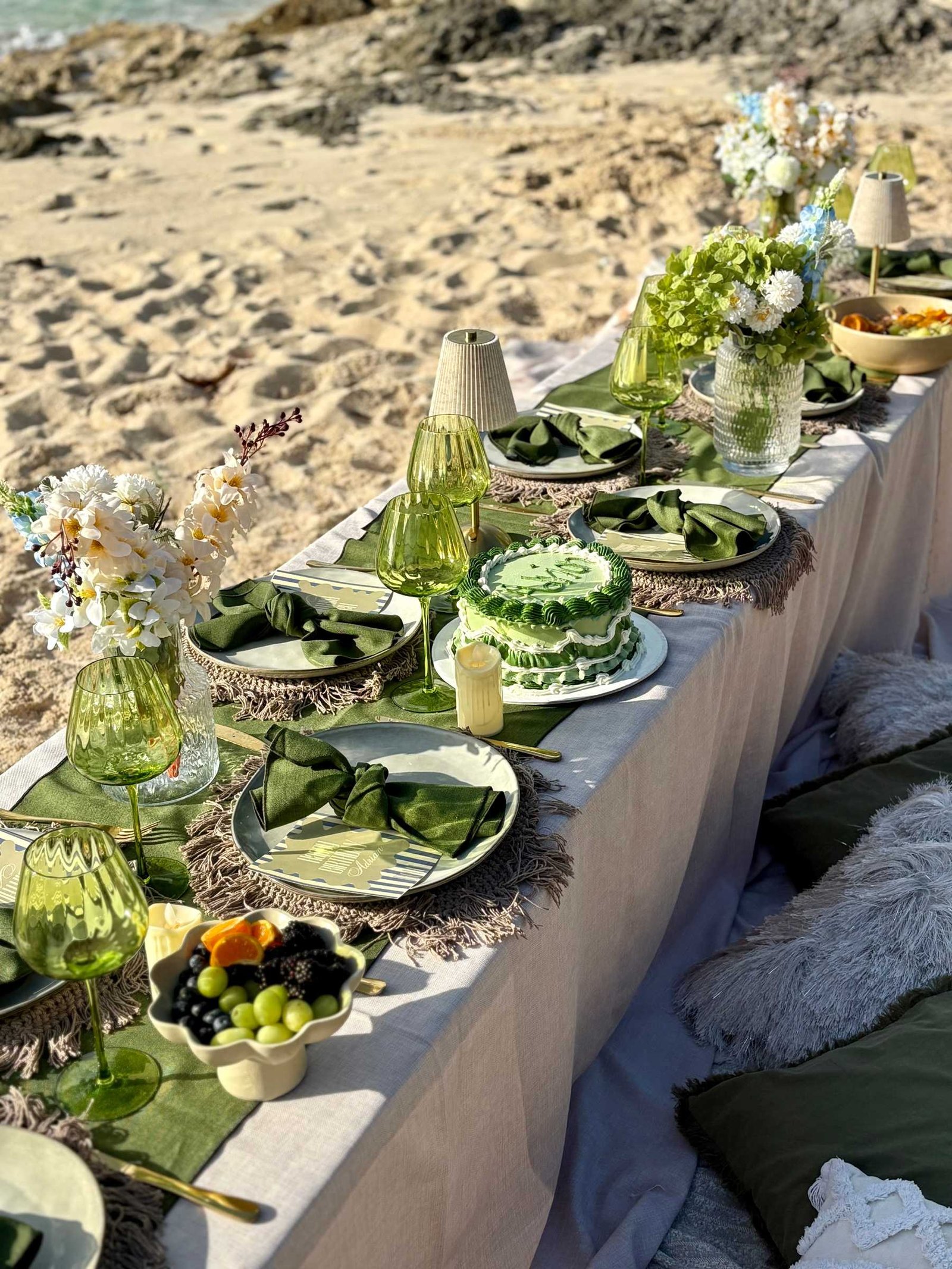 Long table group celebration on the beach in Cozumel in green and white